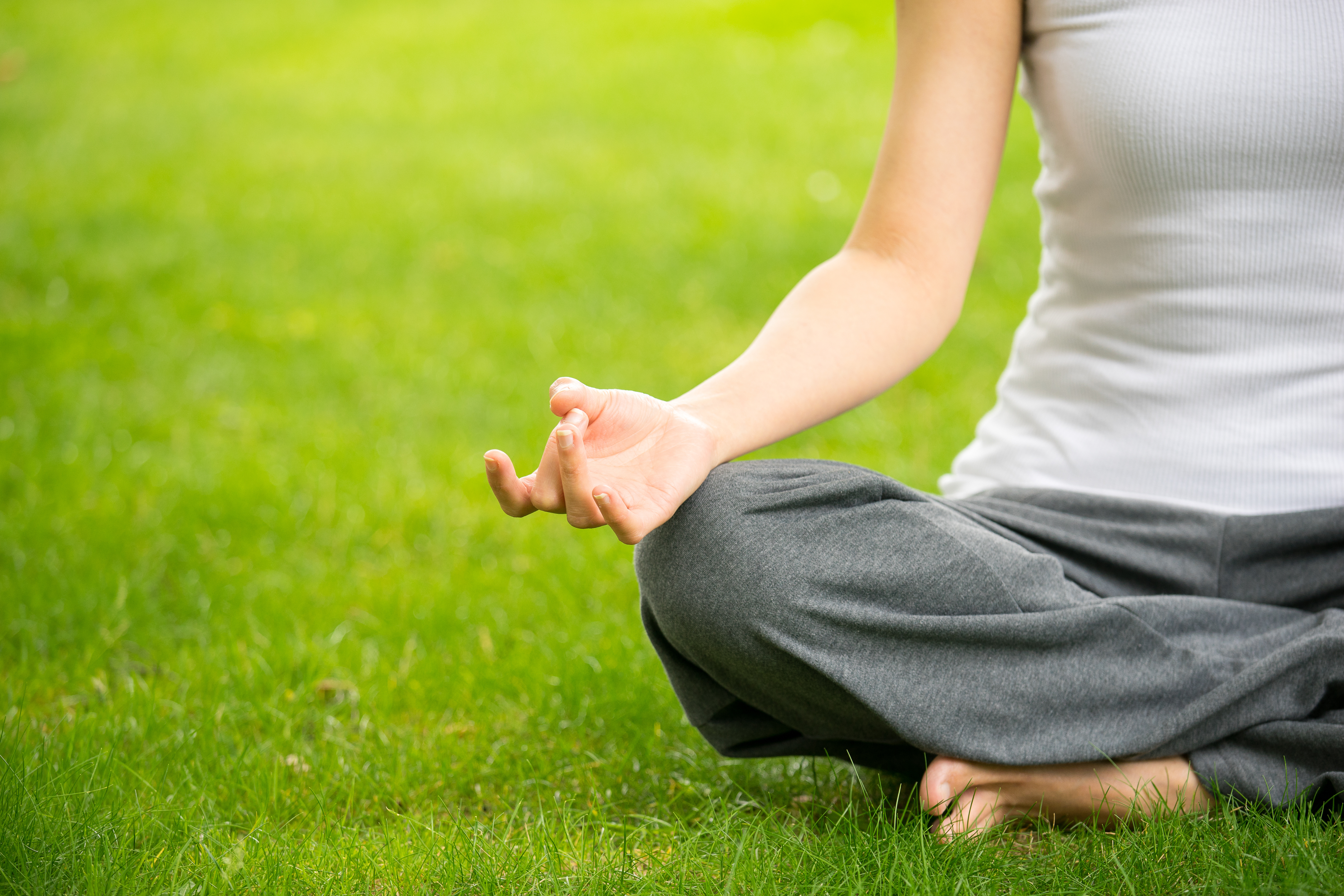 woman meditating and yoga in a park