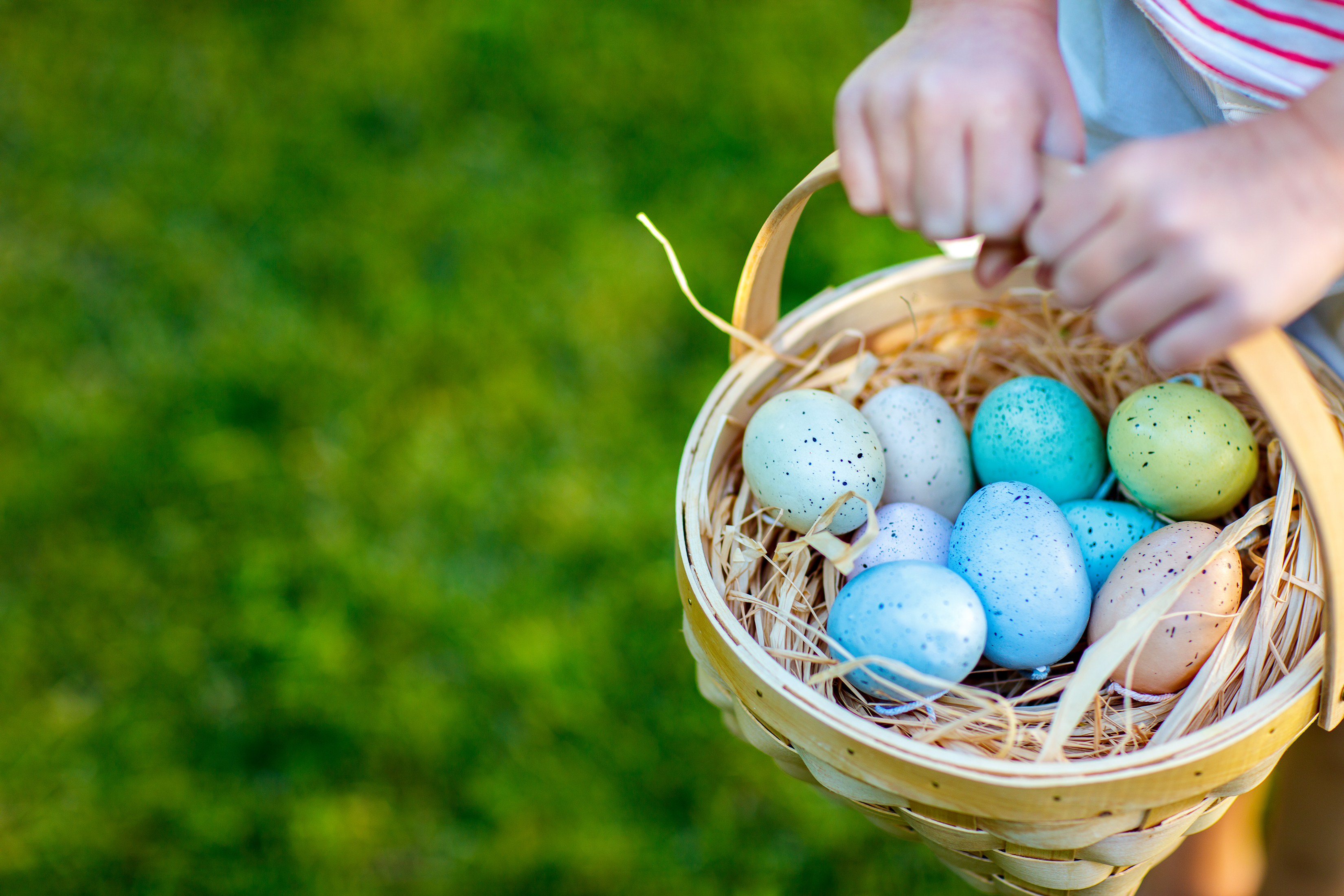 painted eggs in a basket for Easter